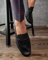 Country Maddox Black Leather Loafers displayed on a wooden surface